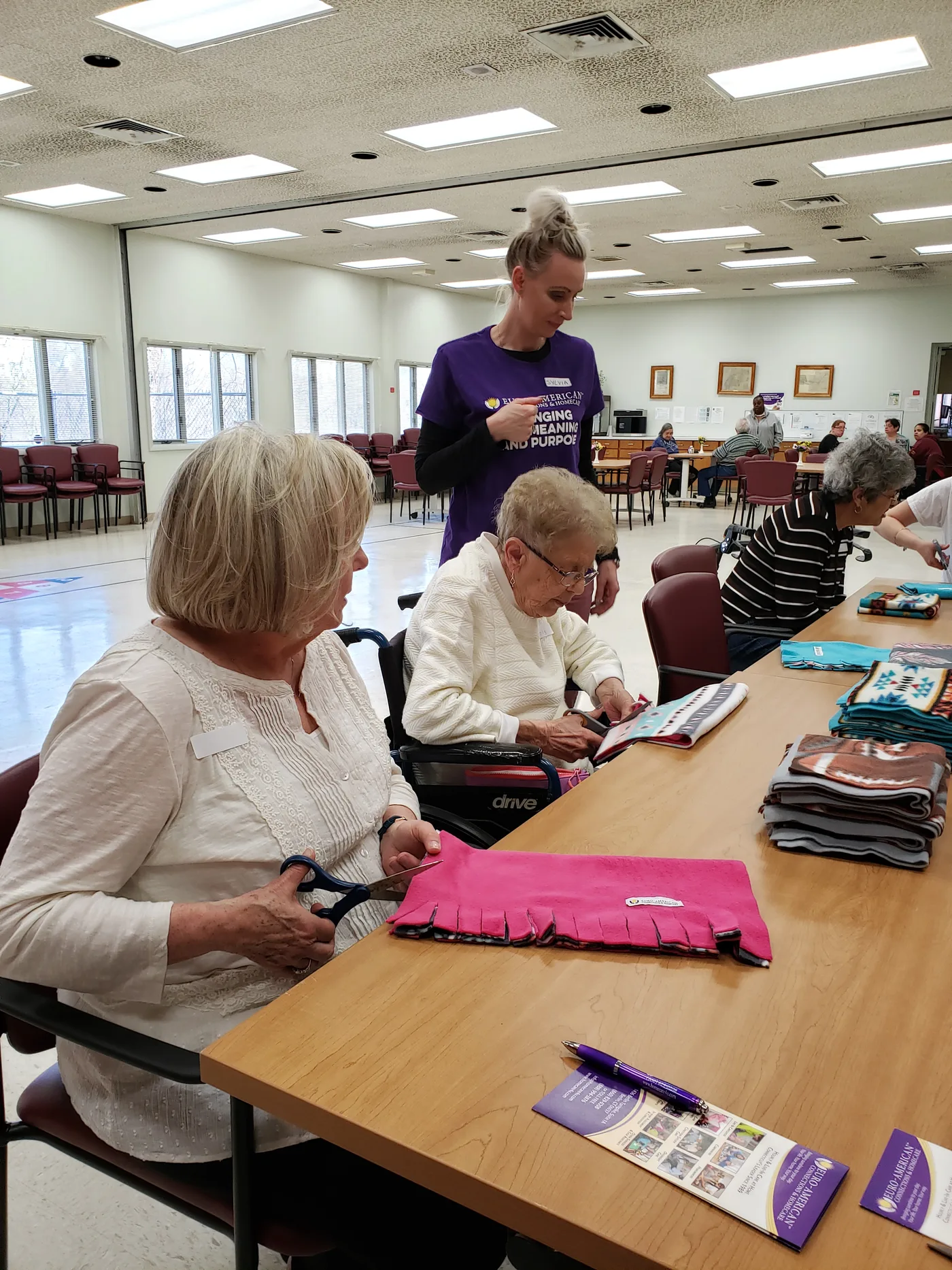 Seniors working on their paintings during a free art class