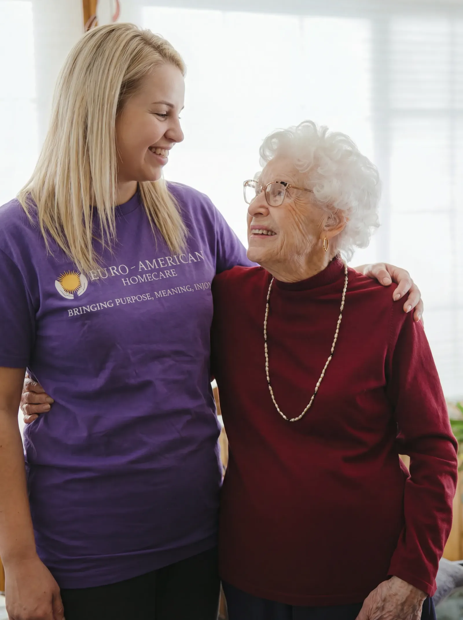 A caregiver and client enjoying time together at home