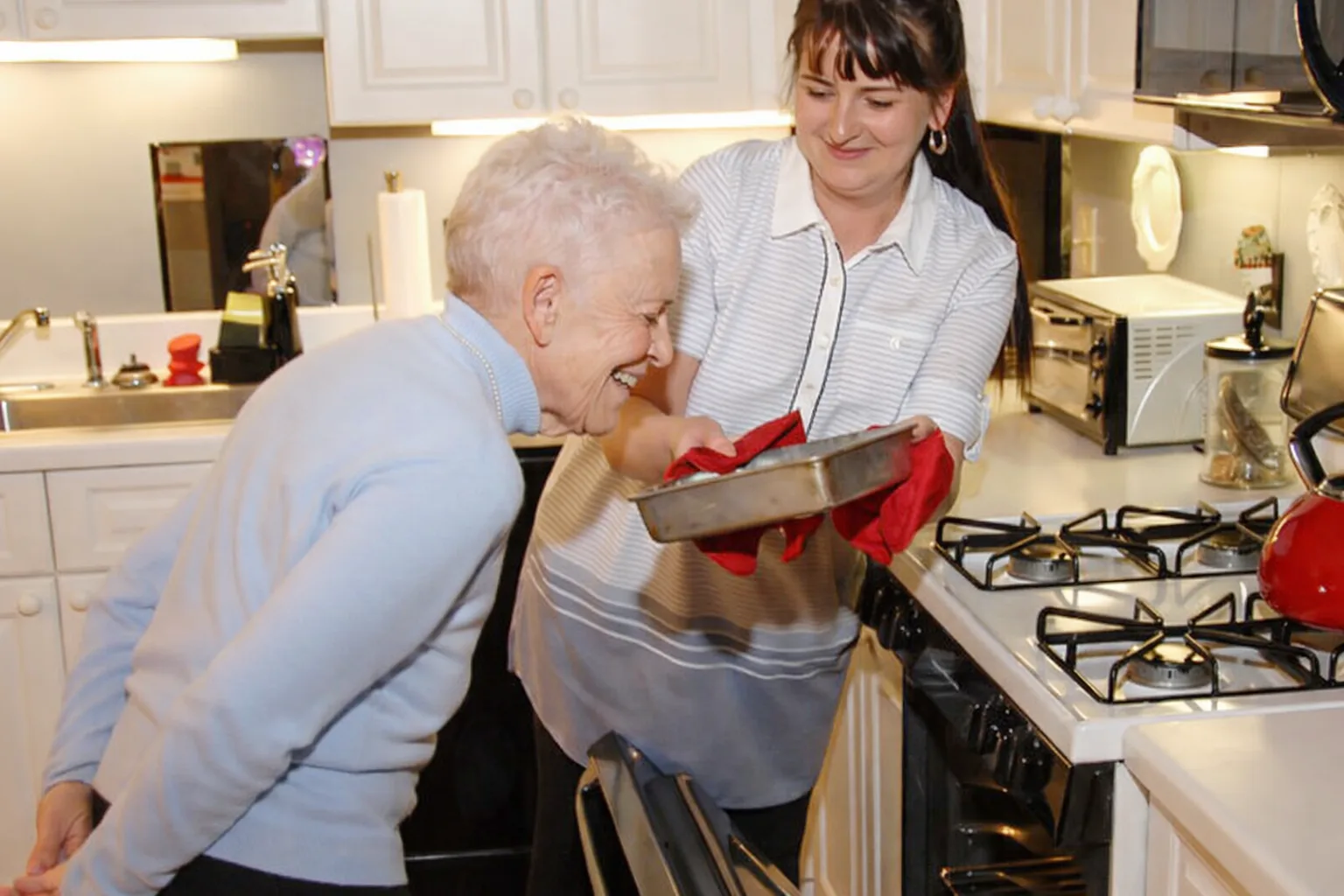 A live-in caregiver supporting a client through the day at home